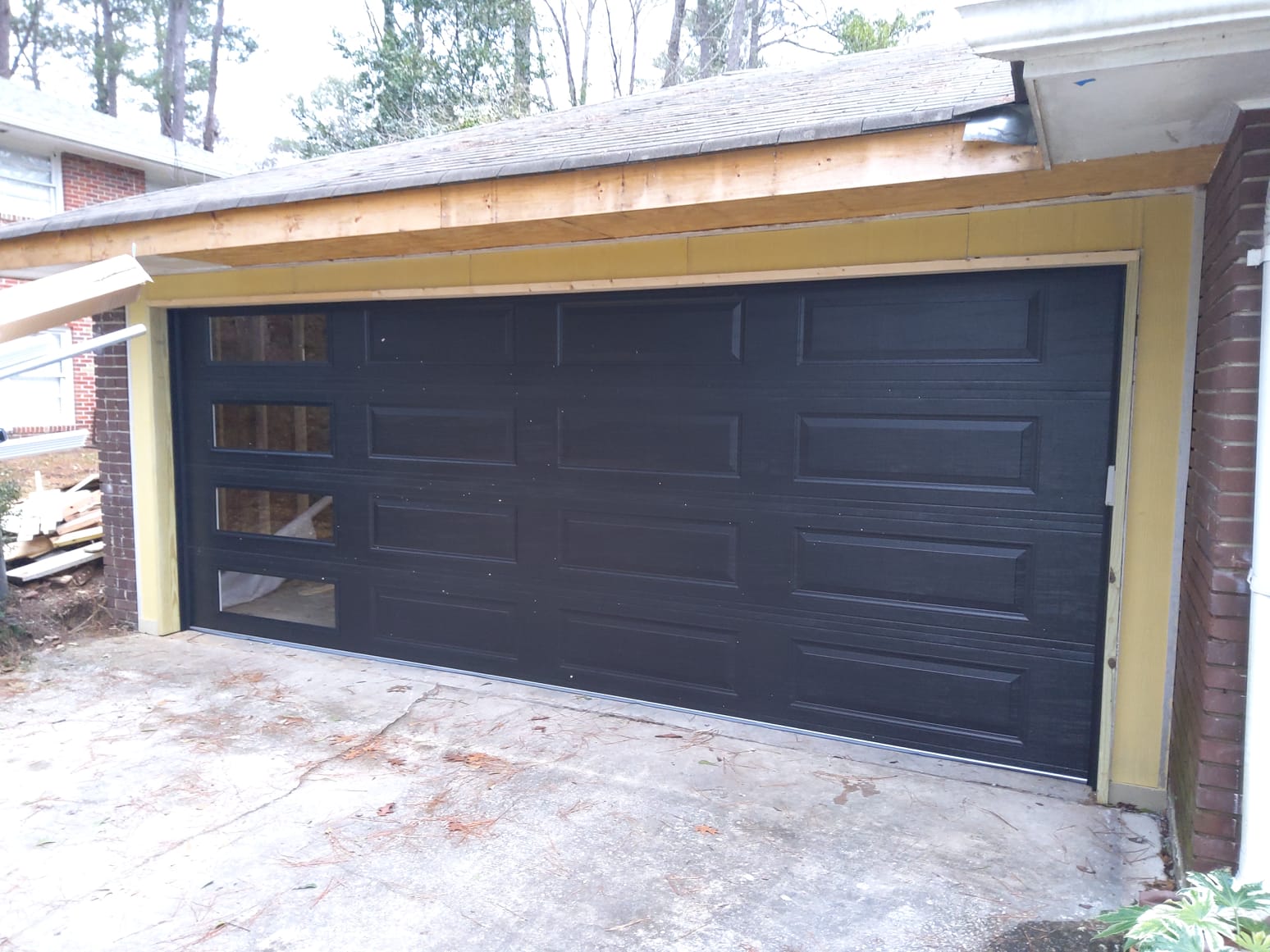 Brown garage door with side windows