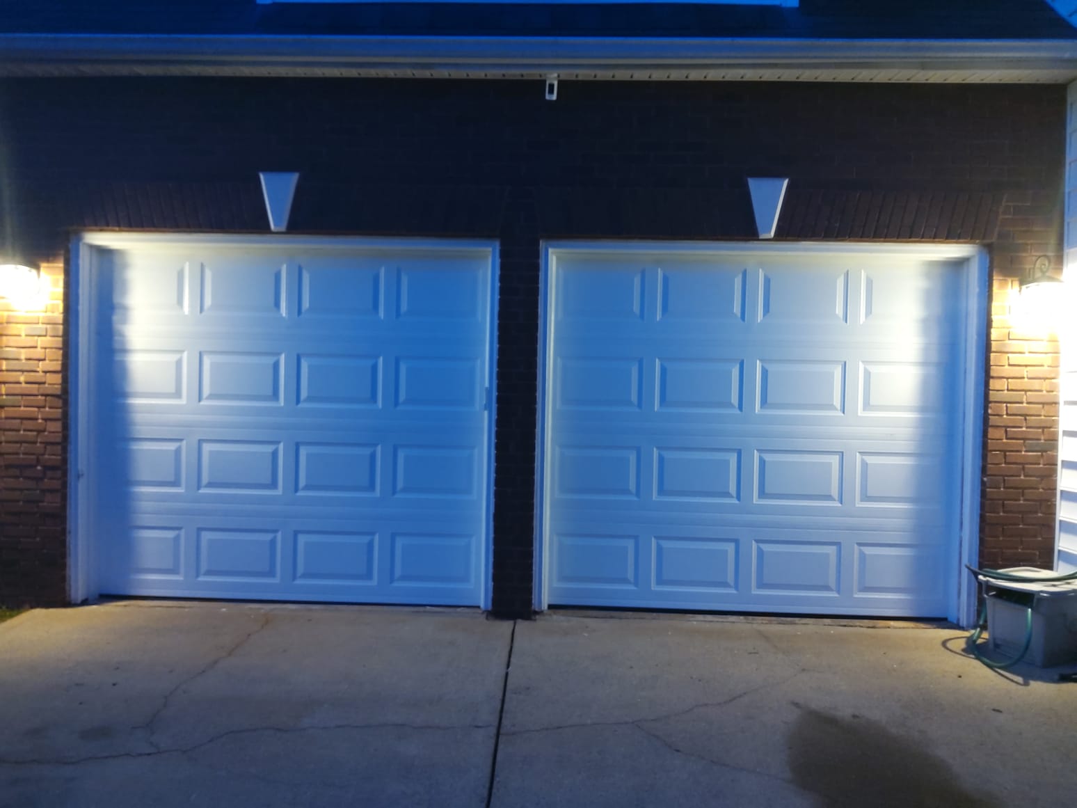 White garage door with lamp