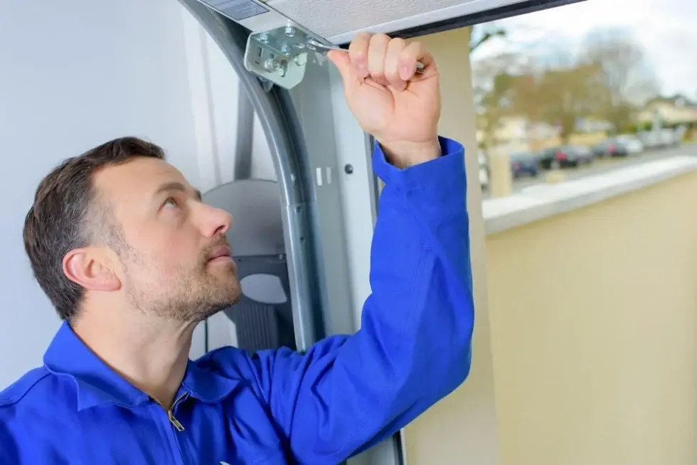 Man repairing a garage door